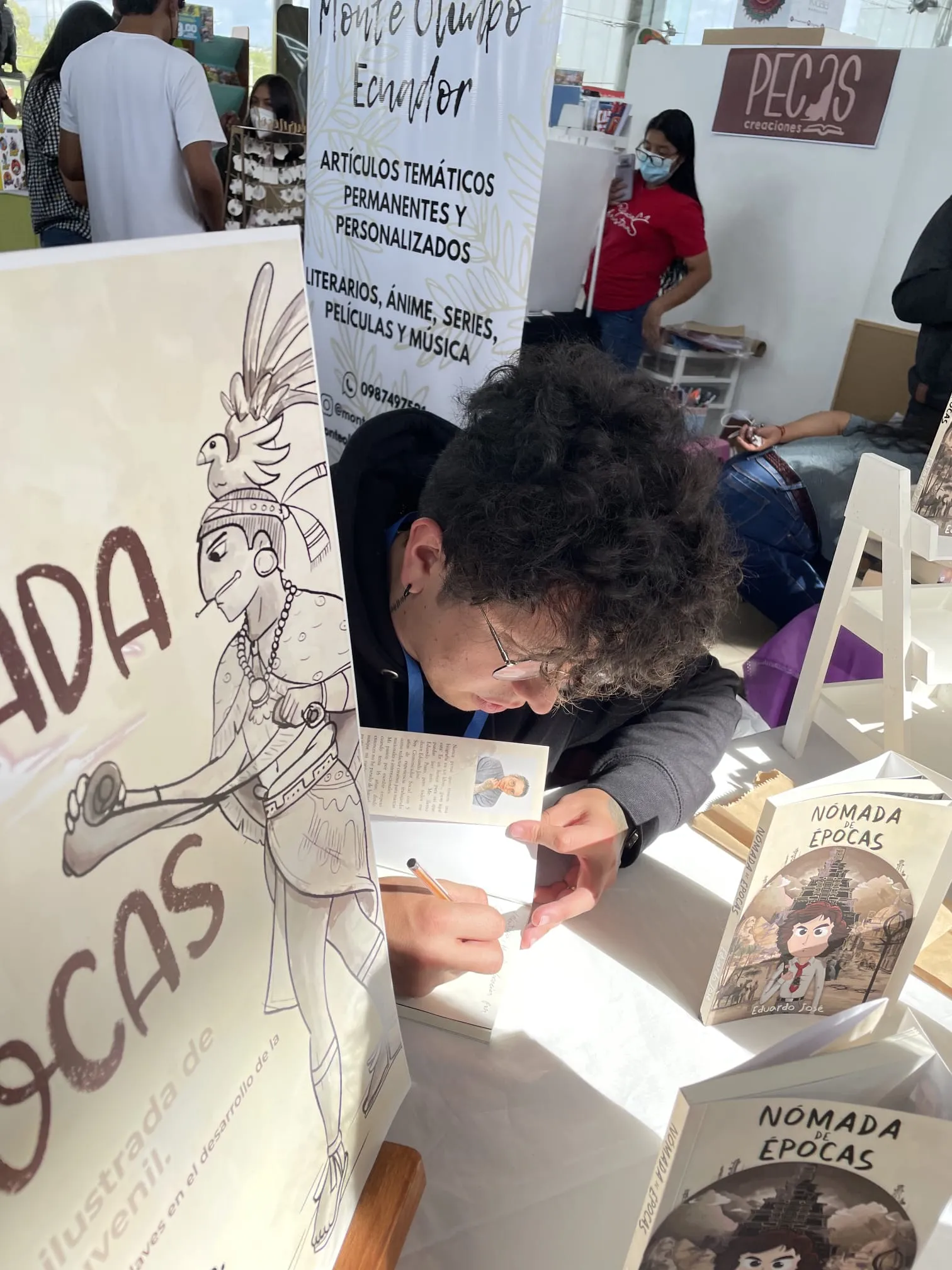 Edu Wayne signing copies of his book